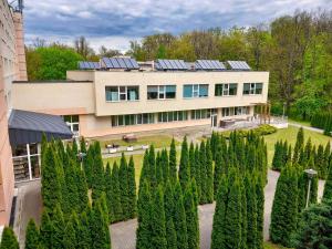 an aerial view of a building with trees in front of it at SP ZOZ Sanatorium Uzdrowiskowe MSWiA Agat in Jelenia Góra