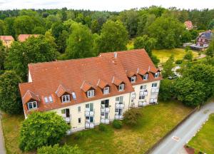 an aerial view of a large building with a red roof at Vision - Apartment - Bad Klosterlausnitz in Bad Klosterlausnitz