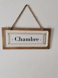 a sign that says chambre hanging on a wall at Chambre privé avec salle de bains privative et dressing in Reugny