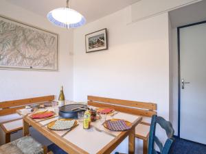 a dining room with a table with a pot on it at Apartment Pegase Phenix-53 by Interhome in Le Corbier +22 photos