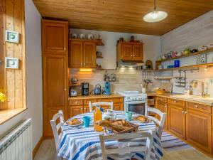 a kitchen with a table with food on it at Holiday Home Bleue - LOQ206 by Interhome in Locquirec