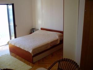 Postel nebo postele na pokoji v ubytování Apartments Đerek Pisak