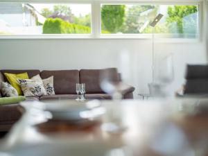 a living room with a couch and a table at Holiday Home Saarland by Interhome in Dittishausen