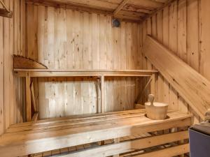 a wooden sauna with a wooden bench in it at Chalet Fjällnäs by Interhome in Tänndalen