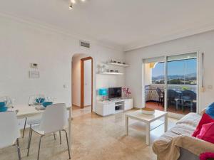 a living room with a couch and a table at Apartment Marina Bay-1 by Interhome in Estepona