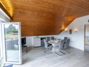 a dining room with a table and chairs at Apartment Hochfirst by Interhome in Dittishausen