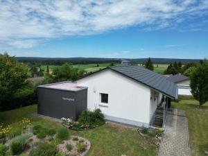 an aerial view of a white house with a solarium at Holiday Home Sophia by Interhome in Dittishausen