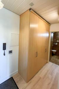 a large wooden door in a room at Apartment Schwarzwaldblick-14 by Interhome in Schonach +9 photos