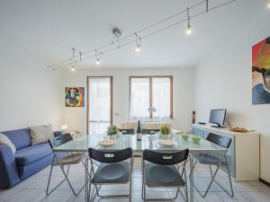 a living room with a glass table and chairs at Apartment Villaggio 5 Terre-4 by Interhome in Soviore