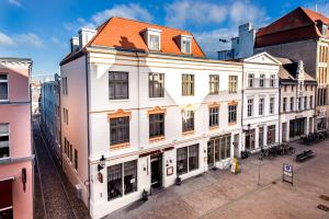 an overhead view of a building in a city at Stadthotel Stern in Wismar