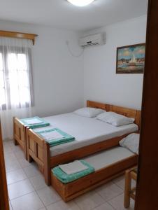 a bedroom with two bunk beds and a window at Apartment Ksenija in Kotor