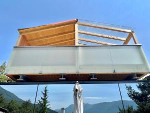 a view from inside a building with a window with a statue at Holiday Home SKY Chalet by Interhome in Imst