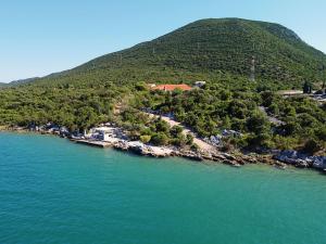 an island in the middle of a body of water at Apartment Waterfront Oasis-3 by Interhome in Mali Ston
