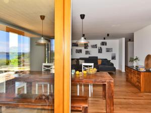 a living room and dining room with a dining table at Holiday Home Villa Baraka by Interhome in Božava