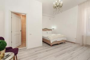 מיטה או מיטות בחדר ב-Large 3BR central apartment