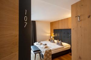 Postel nebo postele na pokoji v ubytování Hotel Ciasa Soleil