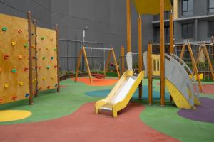 a playground with a slide and a climbing wall at Modern City Getaway - Immerse Yourself In Luxury in Istanbul