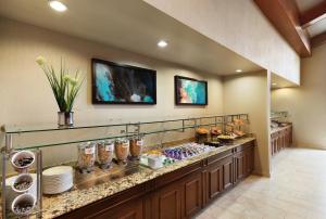 a display case in a store with plates and vases at Residence Inn Joplin in Joplin +30 photos