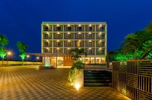 a hotel at night with a building at Effotel by Sayaji Sarola in Bhor