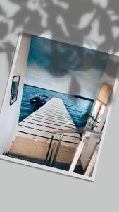 a picture of a boat in the water at Villa Port in Iława +17 photos