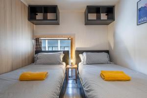 Katil atau katil-katil dalam bilik di Grand Roc A - 3 bedrooms Apartment Next to skilift - By Cozee Rentals