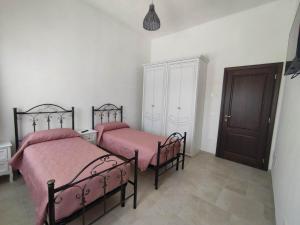 Letto o letti in una camera di L'Humus dei Trulli holiday house