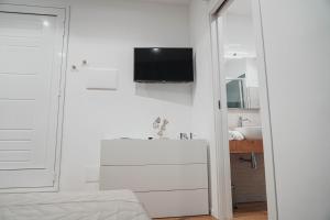 TV a/nebo společenská místnost v ubytování Casa Vacanza Stomar