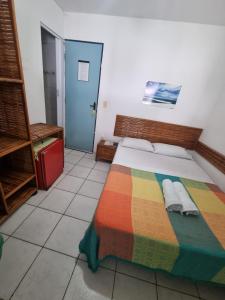 Postel nebo postele na pokoji v ubytování Estalagem Maceió