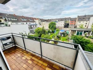 a balcony with a view of a city at NaSa Wohnen Zentrum in Krefeld
