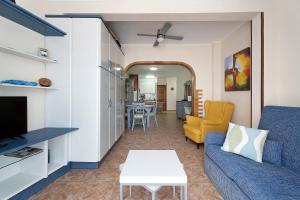 a living room with a couch and a table at Apartment Colina Vista in Los Cristianos