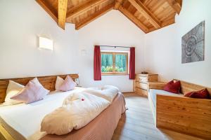 a bedroom with two beds and a window at Ferienhaus Larch Soge Apt Paula in Racines