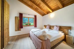 Postel nebo postele na pokoji v ubytování Ferienhaus Larch Soge Apt Helmuth