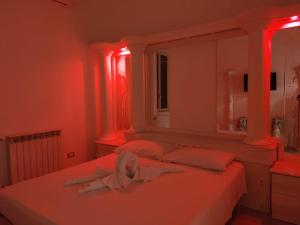 Postel nebo postele na pokoji v ubytování B&B IL TEMPIO