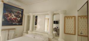 Letto o letti in una camera di B&B IL TEMPIO