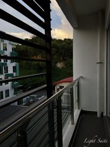 a balcony with a view of a building at Aeropod Sovo Wi-Fi&Netflix 5min From Airport in Kota Kinabalu
