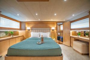 a bedroom in a boat with a bed in it at M/Y Opera in Sami