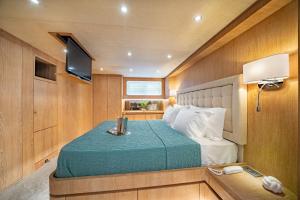 a bedroom with a bed on a boat at M/Y Opera in Sami