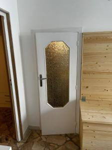 a door with a window in a room at La casa di Ginevra in Polignano a Mare +3 photos