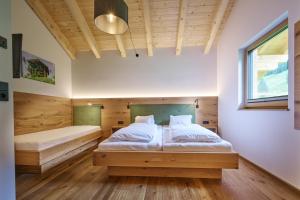 A bed or beds in a room at Ferienwohnungen Schwabhof