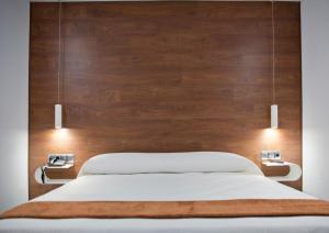 Postel nebo postele na pokoji v ubytování Hotel Los Delfines