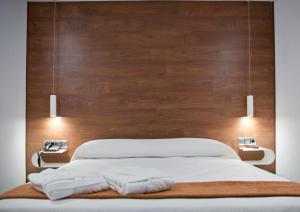Postel nebo postele na pokoji v ubytování Hotel Los Delfines