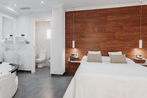 Postel nebo postele na pokoji v ubytování Hotel Los Delfines