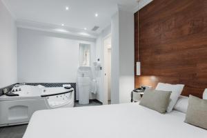 Postel nebo postele na pokoji v ubytování Hotel Los Delfines
