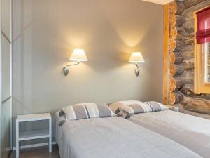 Postel nebo postele na pokoji v ubytování Holiday Home Kuukkahainen by Interhome