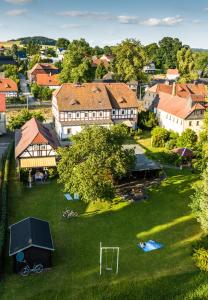 an aerial view of a town with a soccer field at Komfort-Ferienwohnung "Zur Schmiedebrücke" in Großschönau
