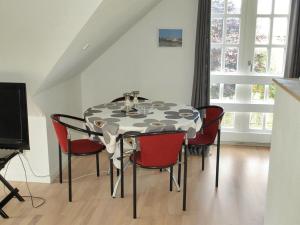 a dining room with a table and chairs at Apartment Rosabel - 1km from the sea in NW Jutland by Interhome in Skagen