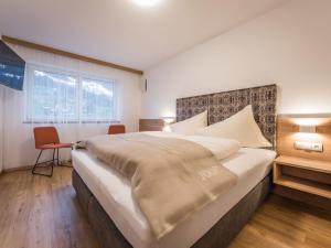 Postel nebo postele na pokoji v ubytování Apartment Montec Apart 2 by Interhome