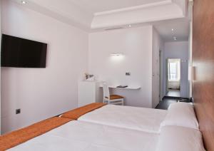 Postel nebo postele na pokoji v ubytování Hotel Los Delfines