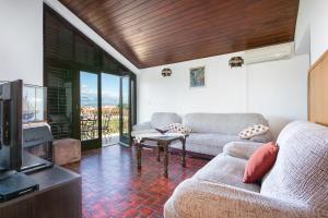 a living room with a couch and a tv at Apartments by the sea Mirca, Brac - 732 in Mirce