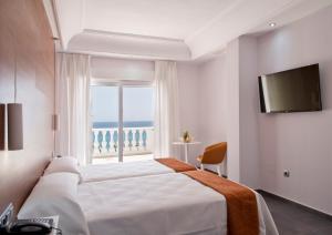 Postel nebo postele na pokoji v ubytování Hotel Los Delfines